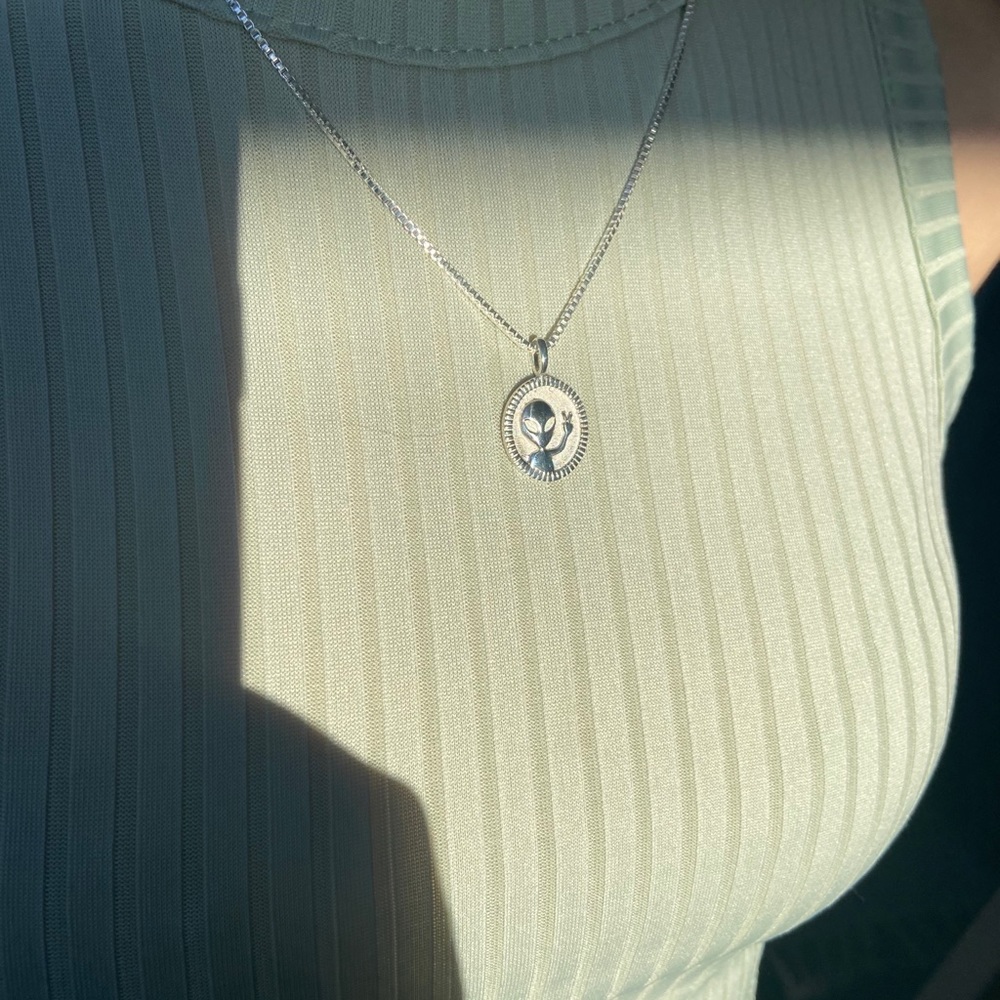 Silver alien pendant